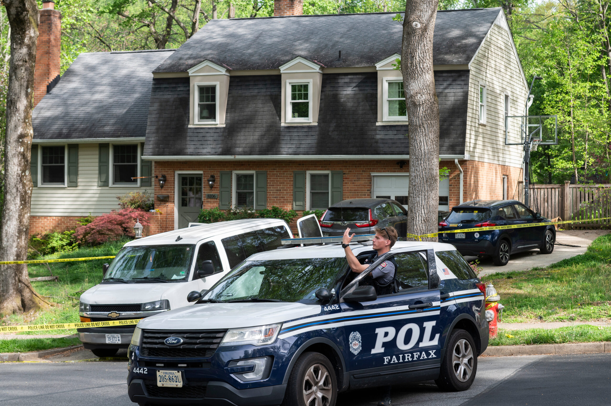 Police vehicles gathered outside the Annandale home of former Virginia Lt. Governor Justin Fairfax.
