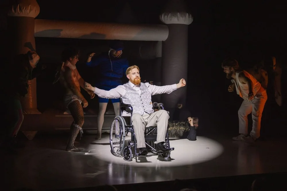 Michael Patrick performing on stage in a wheelchair during his award-winning run in The Tragedy of Richard III