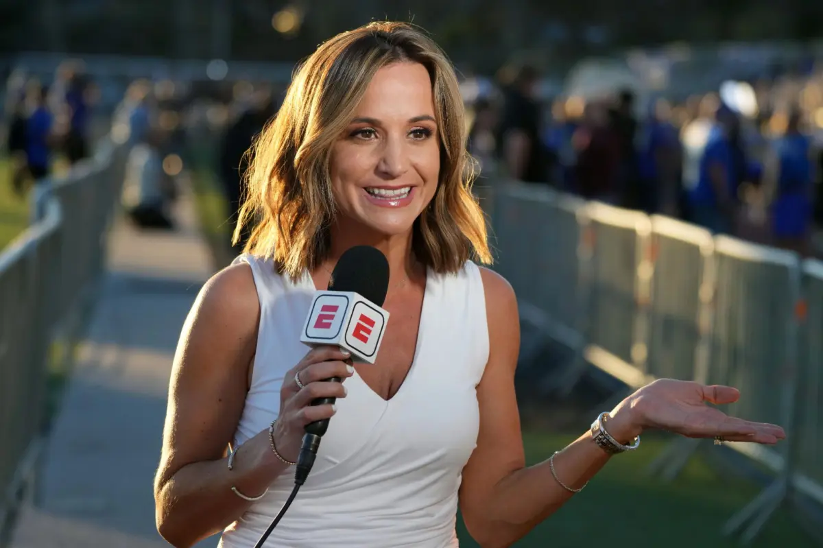 Dianna Russini reporting live from an NFL stadium sideline