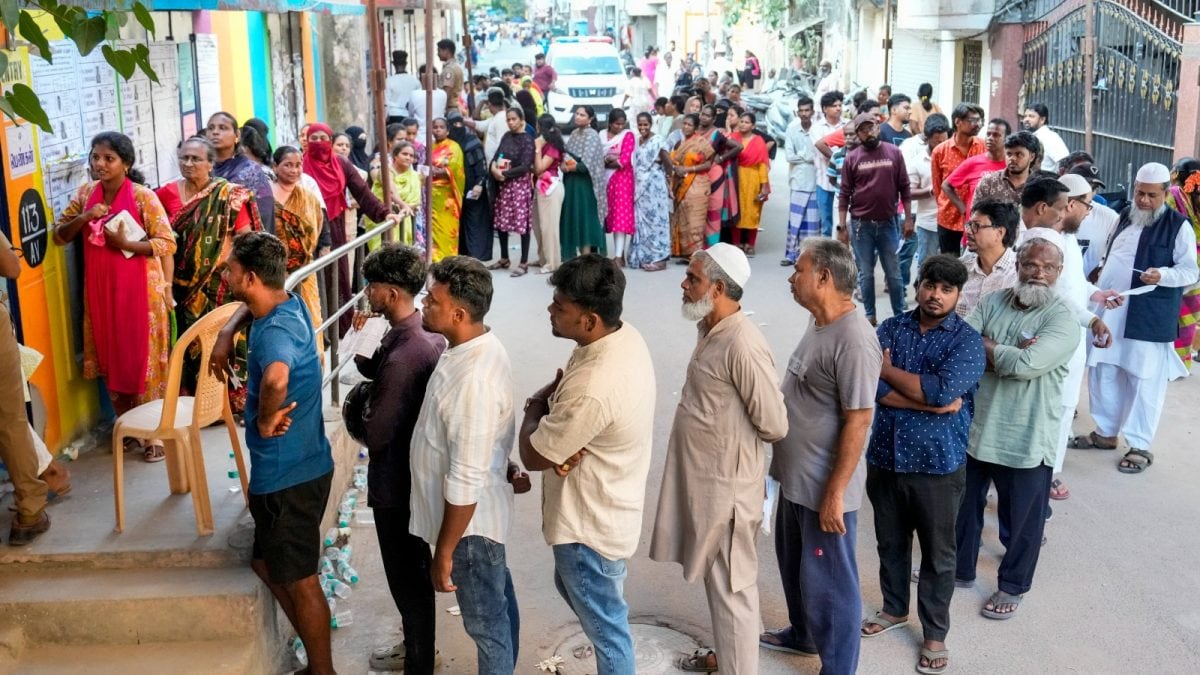 Image of voters queuing at a polling booth during West Bengal elections 2026, illustrating high voter turnout.