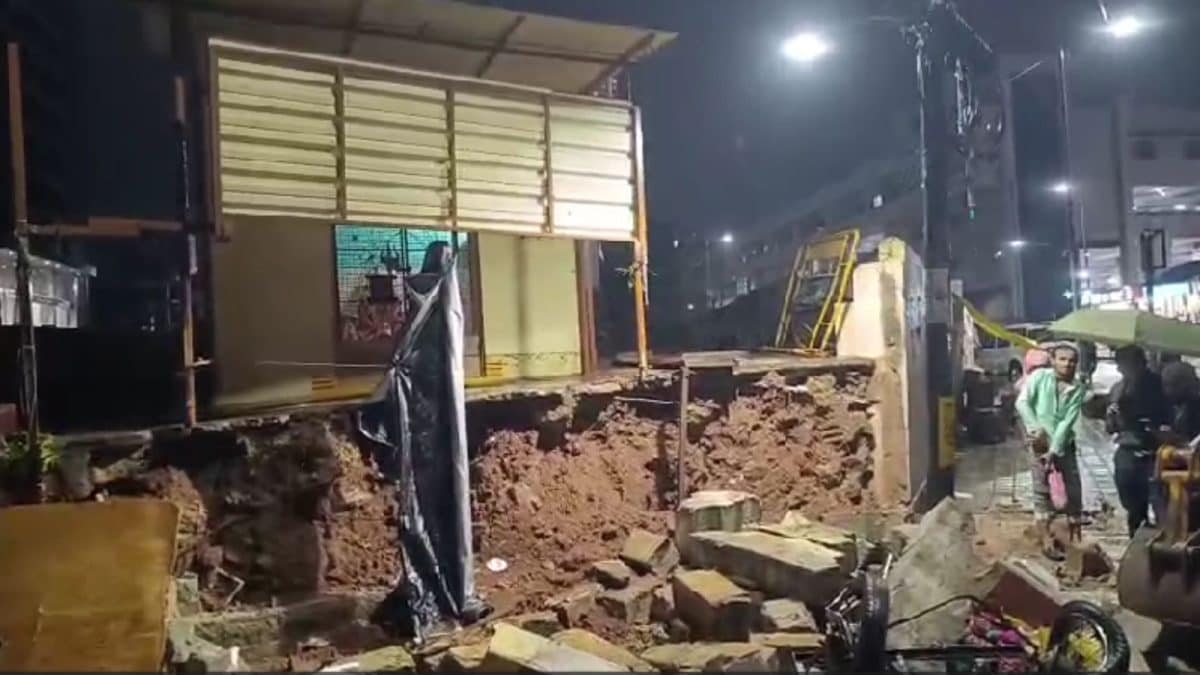 Image of damage from the Bengaluru storm, including collapsed wall or flooded streets.