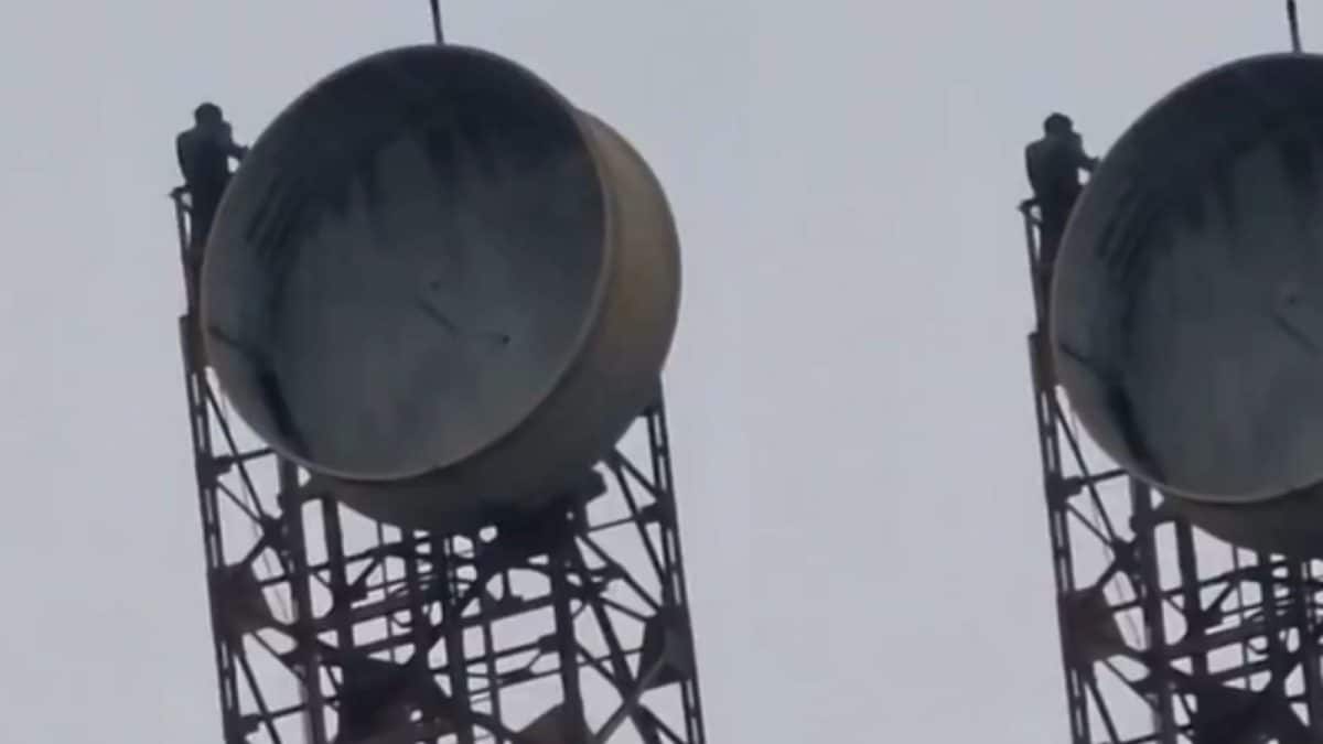 A man identified as Anish Kumar dramatically perched atop a 300-foot mobile tower near Muzaffarpur Junction, demanding to see his girlfriend, recreating a scene reminiscent of the Bollywood movie 'Sholay'.