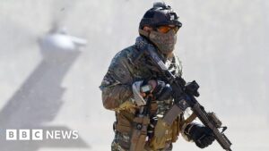 US Air Force pararescuemen during a training exercise, emphasizing their role in combat rescue missions.