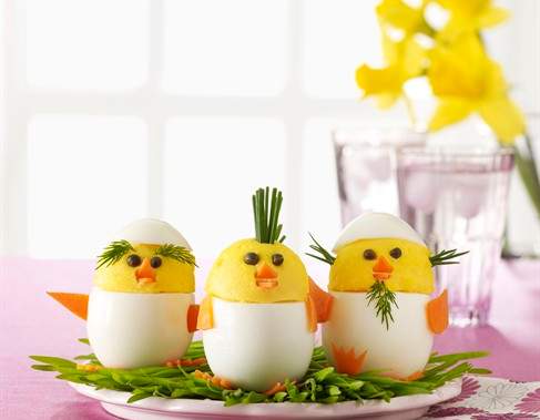 A vibrant close-up of a prepared taco scramble with fresh avocado, cilantro, and salsa, ready for an Easter brunch.
