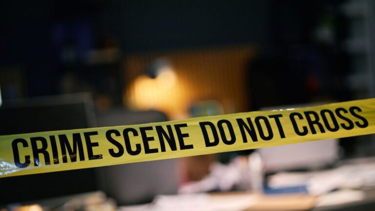 A general image representing crime news, possibly with police presence or caution tape.