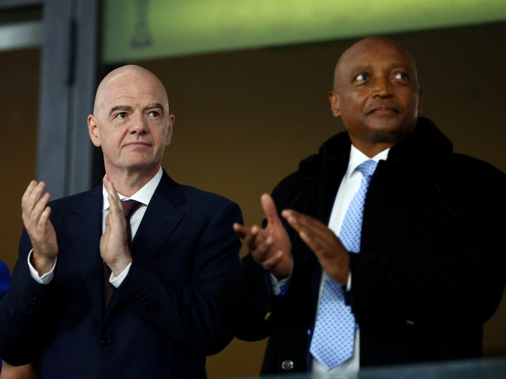 FIFA President Gianni Infantino shakes hands with CAF President Patrice Motsepe