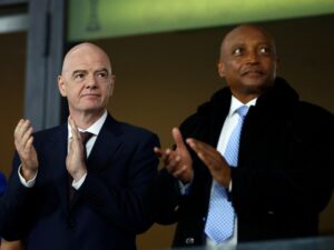 FIFA President Gianni Infantino shakes hands with CAF President Patrice Motsepe