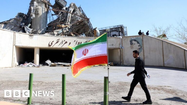 Image of damaged infrastructure in Iran following a strike, symbolizing the human cost of conflict.