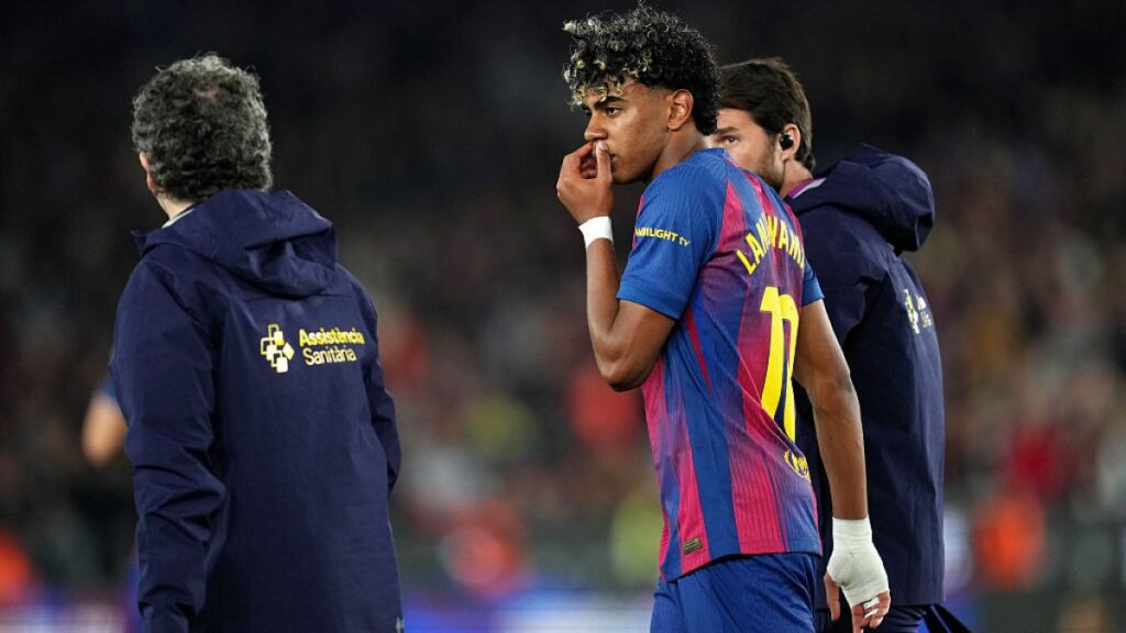 Spanish sensation Lamine Yamal reacts in pain after sustaining a hamstring injury during a Barcelona match.