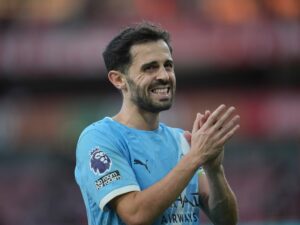 Bernardo Silva in his Manchester City kit, a key figure in the team's success, preparing for his departure at the end of the season.