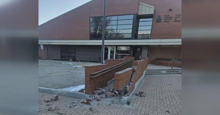 Image showing damage to a wheelchair ramp at the Dauphin RCMP detachment after a stolen taxi crashed into it.