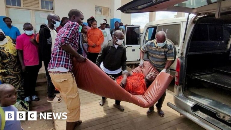 A man is carried from an ambulance to a hospital in Bunia, DR Congo, following an Ebola outbreak confirmation. A health worker in full protective gear enters an Ebola treatment centre in Beni.