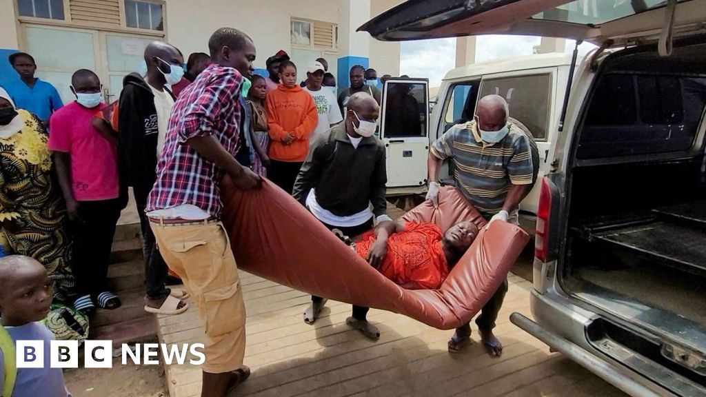 A man is carried from an ambulance to a hospital in Bunia, DR Congo, following an Ebola outbreak confirmation. A health worker in full protective gear enters an Ebola treatment centre in Beni.