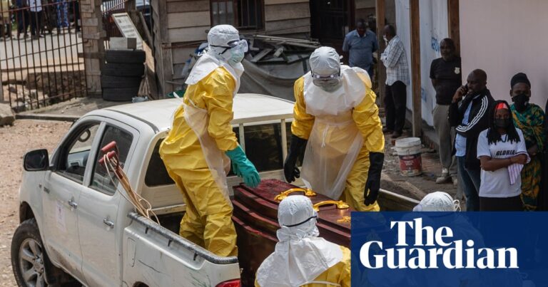 Health workers in yellow protective suits prepare to transport an Ebola victim's body in Bunia, DRC, highlighting the severity of the Ebola outbreak DRC.