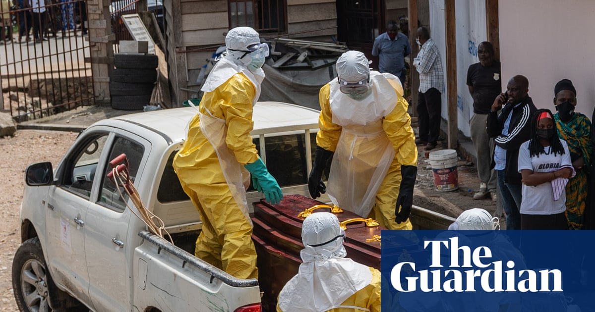 Health workers in yellow protective suits prepare to transport an Ebola victim's body in Bunia, DRC, highlighting the severity of the Ebola outbreak DRC.