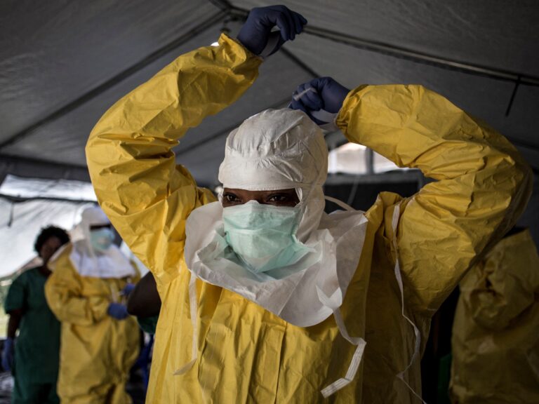 A medical worker in full protective equipment at an Ebola treatment center in DRC.