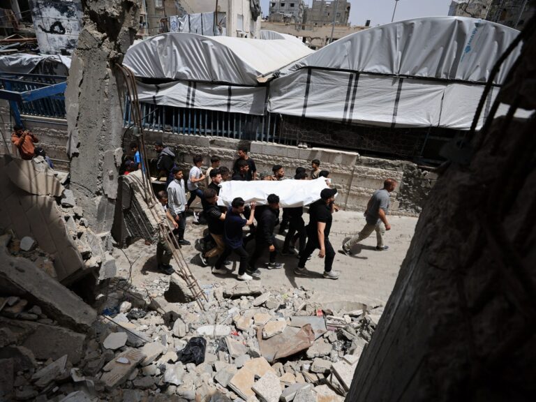 Devastation in Gaza City following Israeli strikes, impacting civilian populations and aid operations.