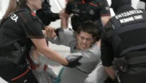 Spanish police clashing with Gaza Flotilla activists at Bilbao airport.