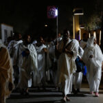 Hajj pilgrims arrive in Mina near Mecca for Arafah Day, a spiritual journey.