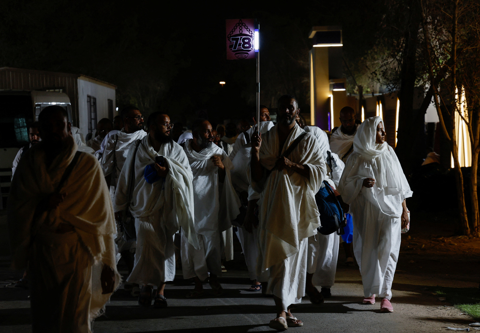 Hajj pilgrims arrive in Mina near Mecca for Arafah Day, a spiritual journey.