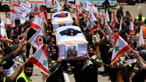 Somber gathering at the funeral of two Lebanese paramedics.