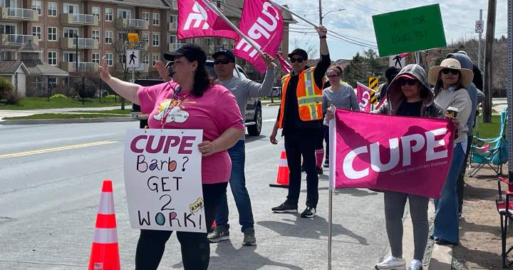 Image of striking CUPE long-term care workers in Nova Scotia. The photo shows workers picketing outside Glasgow Hall in Dartmouth, highlighting the ongoing labor dispute.