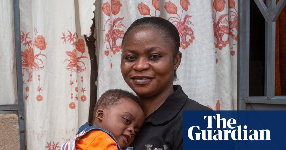 Naomi holding her baby, Wonder, who was among the first infants to receive the new malaria treatment Coartem Baby.
