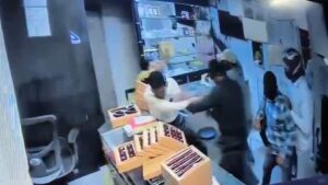 CCTV image showing armed robbers entering a jewellery store in Nashik, Maharashtra, during a recent attack that injured one.
