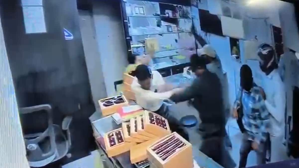 CCTV image showing armed robbers entering a jewellery store in Nashik, Maharashtra, during a recent attack that injured one.
