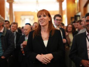 Angela Rayner smiles, looking determined after her tax clearance announcement.