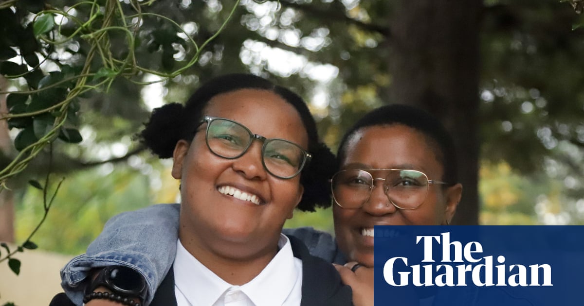 Smiling couple Bonolo Selelo and Tsholofelo Kumile, left and right respectively, seeking to legalise same-sex marriage in Botswana.