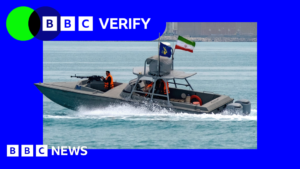 Image of an Iranian speedboat in the Strait of Hormuz, symbolizing Iran's heightened military claims.