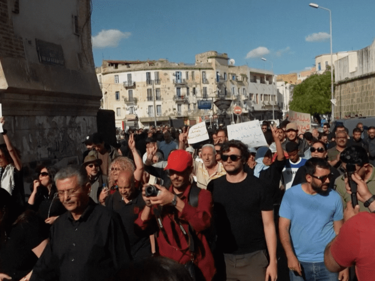 Hundreds join Tunisian protests in the capital, decrying economic hardship & a political crackdown. President Saied faces accusations of undermining democracy.