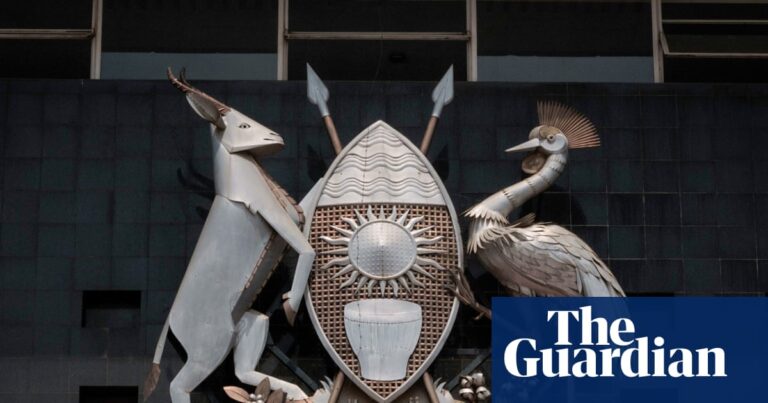 Uganda's coat of arms on parliament building, symbolic of national identity, amid debate over new sovereignty bill.