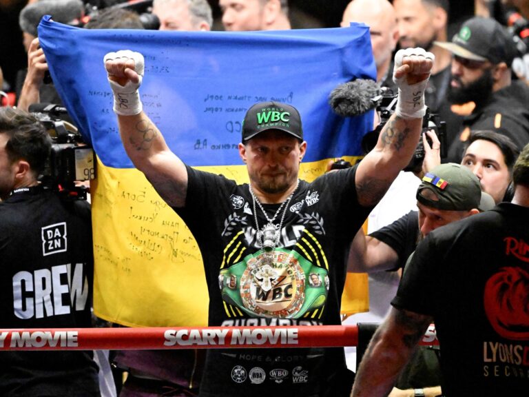 Ukrainian boxer Oleksandr Usyk celebrates his dramatic 11th-round TKO win over Rico Verhoeven at the Pyramids of Giza.