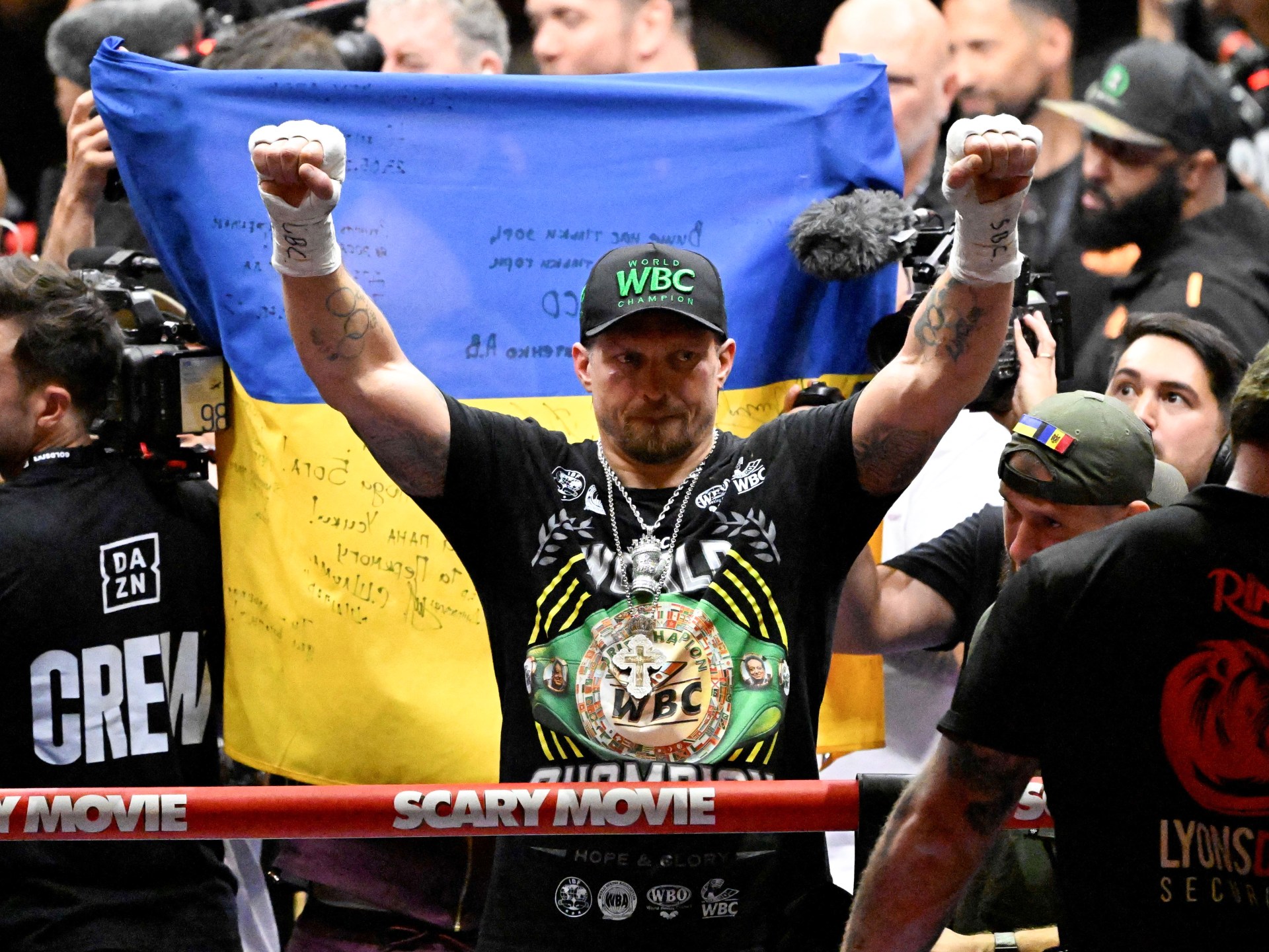 Ukrainian boxer Oleksandr Usyk celebrates his dramatic 11th-round TKO win over Rico Verhoeven at the Pyramids of Giza.