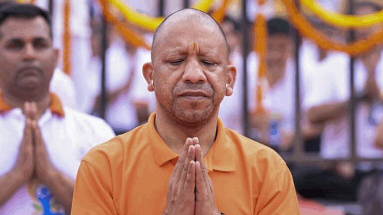 CM Yogi Adityanath leading a mass yoga session, promoting daily yoga for national health.