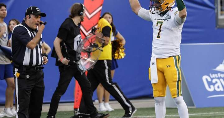 Quarterback Cody Fajardo disputes a call during a CFL game between the Edmonton Elks and Winnipeg Blue Bombers.