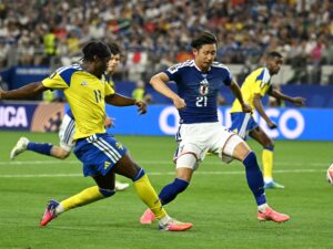 Japan and Sweden players in a 1-1 World Cup match