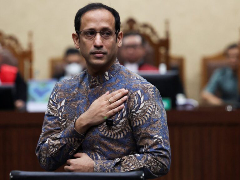 Nadiem Makarim gestures in court after his corruption verdict