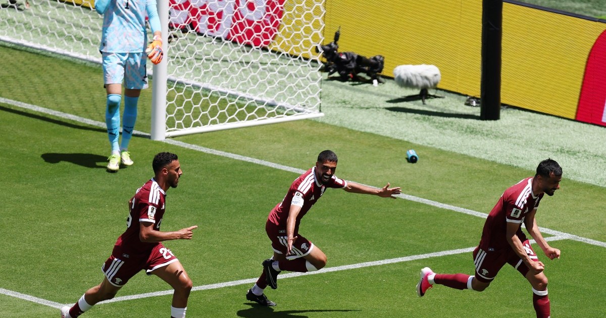 Boualem Khoukhi celebrates with teammates after scoring Qatar's equalizer against Switzerland in the World Cup 2026 Group B match.