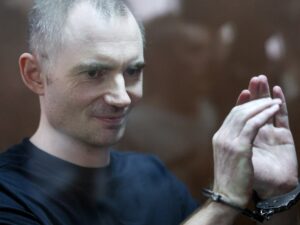 Image of Russian opposition leader Maxim Kruglov facing legal action for anti-war posts.