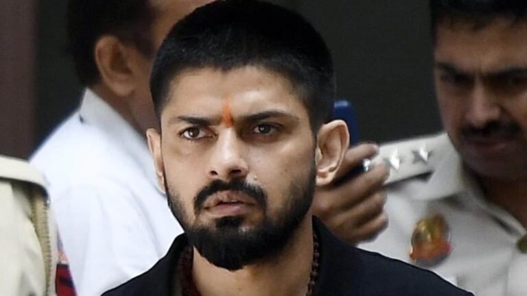 Image of Lawrence Bishnoi, central figure in the recent Bishnoi gang crackdown, against a backdrop symbolizing global law enforcement cooperation.