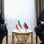Iranian Foreign Minister Abbas Araghchi with Russian Foreign Minister Sergey Lavrov discussing regional tensions after the Caspian Sea incident.
