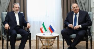 Iranian Foreign Minister Abbas Araghchi with Russian Foreign Minister Sergey Lavrov discussing regional tensions after the Caspian Sea incident.