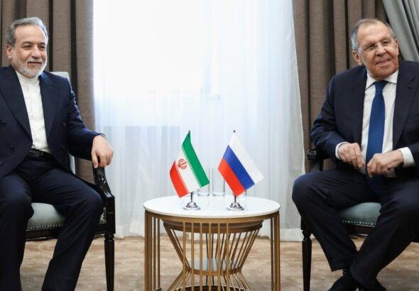 Iranian Foreign Minister Abbas Araghchi with Russian Foreign Minister Sergey Lavrov discussing regional tensions after the Caspian Sea incident.