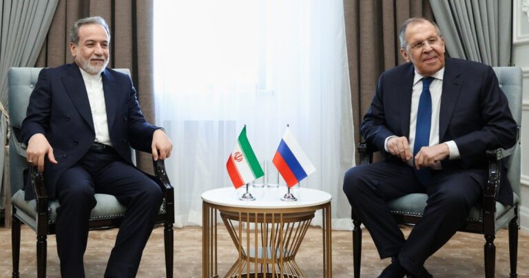 Iranian Foreign Minister Abbas Araghchi with Russian Foreign Minister Sergey Lavrov discussing regional tensions after the Caspian Sea incident.