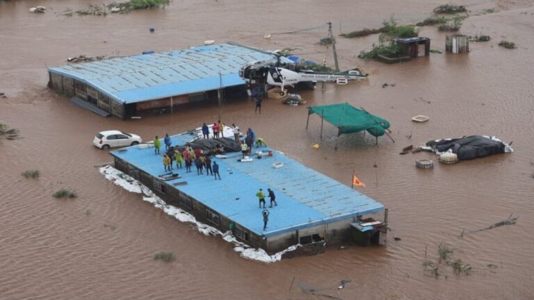 Indian Coast Guard personnel conducting flood relief operations in Gujarat and Dadra & Nagar Haveli.