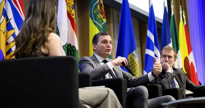 Evan Solomon and Marc Miller at a Gen(Z)AI Plenary Convening fireside chat discussing digital innovation and regulation.