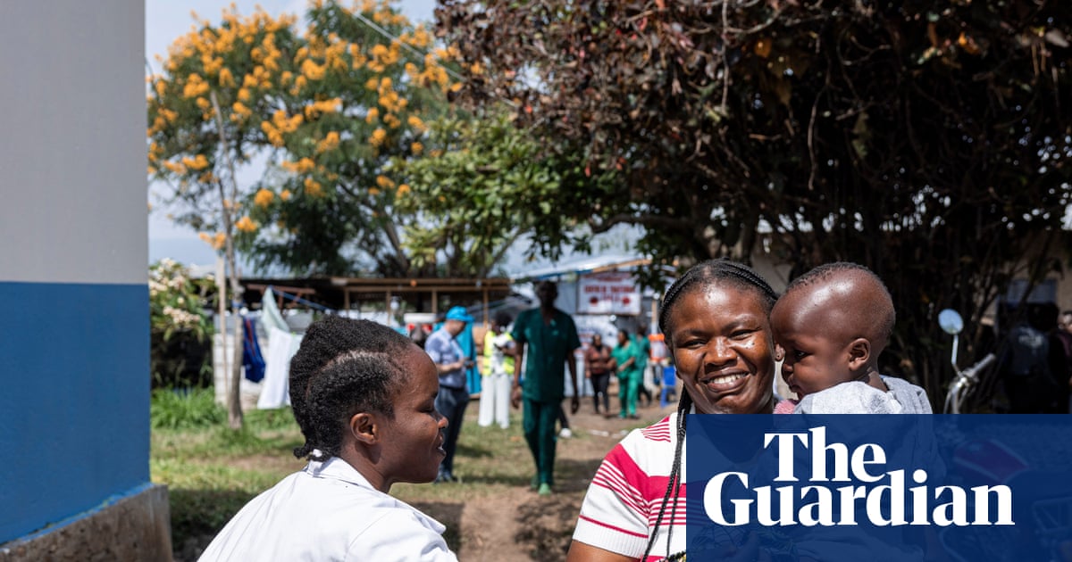 Ebola survivor Mireille Kahindo holds her 16-month-old son Micky Paul upon discharge from hospital in DRC.